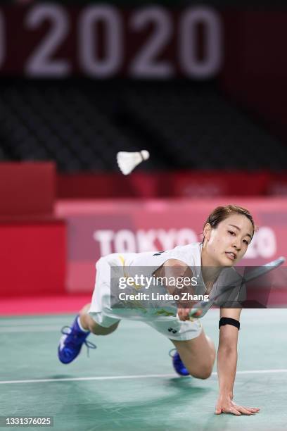 Nozomi Okuhara of Team Japan competes against He Bing Jiao of Team China during a Women's Singles Quarterfinal match on day seven of the Tokyo 2020...