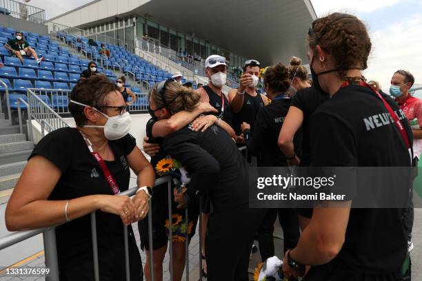 Team New Zealand Women's Eight hug members of their team after winning the silver medal during the Women's Eight Final A on day seven of the Tokyo...