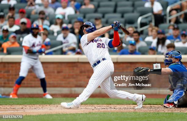 Pete Alonso of the New York Mets follows through on his sixth inning two run home run against the Toronto Blue Jays at Citi Field on July 25, 2021 in...