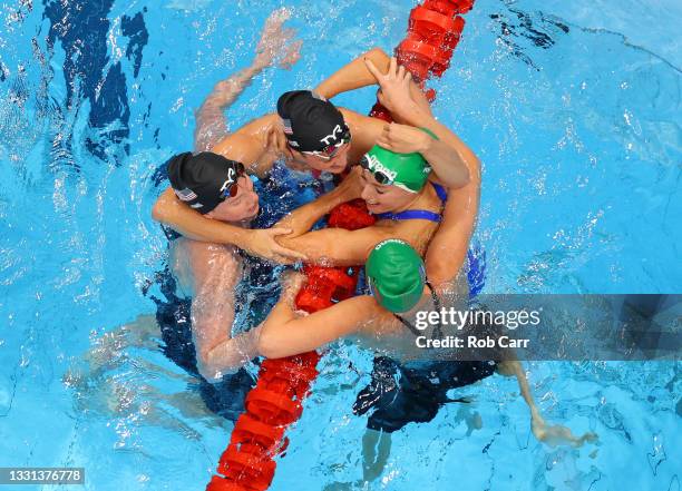 Tatjana Schoenmaker of Team South Africa is congratulated by Lilly King of Team United States, Annie Lazor of Team United States and Kaylene Corbett...