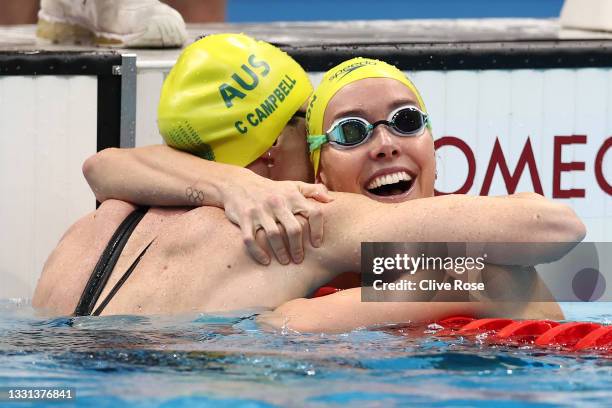 Emma McKeon of Team Australia is congratulated by Cate Campbell of Team Australia after winning gold and breaking the olympic record in the Women's...