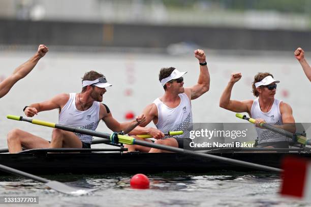 Daniel Williamson, Michael Brake and Tom Murray of Team New Zealand celebrate winning the gold medal during the Men's Eight Final A on day seven of...