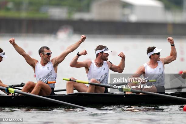 Phillip Wilson, Daniel Williamson and Michael Brake of Team New Zealand celebrate winning the gold medal during the Men's Eight Final A on day seven...