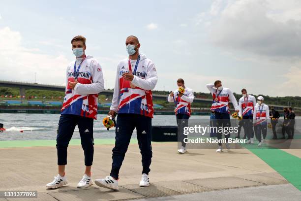 Bronze medalists Team Great Britain walk after receiving their medals during the medal ceremony for the Men's Eight Final A on day seven of the Tokyo...