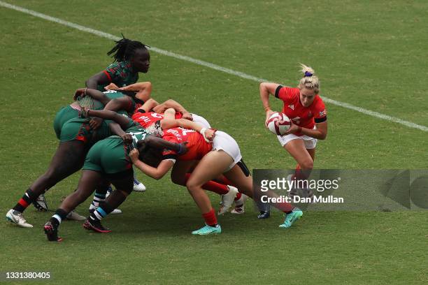Natasha Hunt of Team Great Britain runs the ball from the scrum in the Women’s pool A match between Team Great Britain and Team Kenya during the...