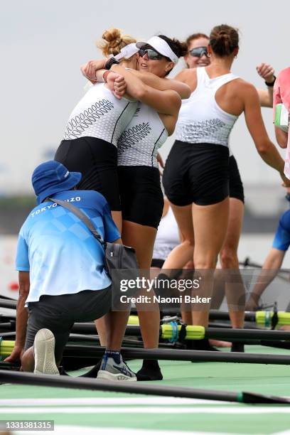 Grace Prendergast, Kelsey Bevan, Lucy Spoors and Emma Dyke of Team New Zealand celebrate winning the silver medal after the Women's Eight Final A on...