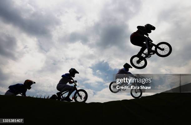 General view of Sylvain Andre of Team France, Romain Mahieu of Team France and Connor Fields of Team United States as they jump during the Men's BMX...