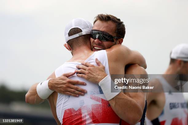 Team Great Britain celebrate winning the bronze medal during the Men's Eight Final A on day seven of the Tokyo 2020 Olympic Games at Sea Forest...