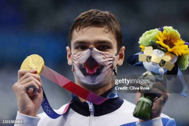 Evgeny Rylov of Team ROC poses with the gold medal for the Men's 200m Backstroke Final on day seven of the Tokyo 2020 Olympic Games at Tokyo Aquatics...