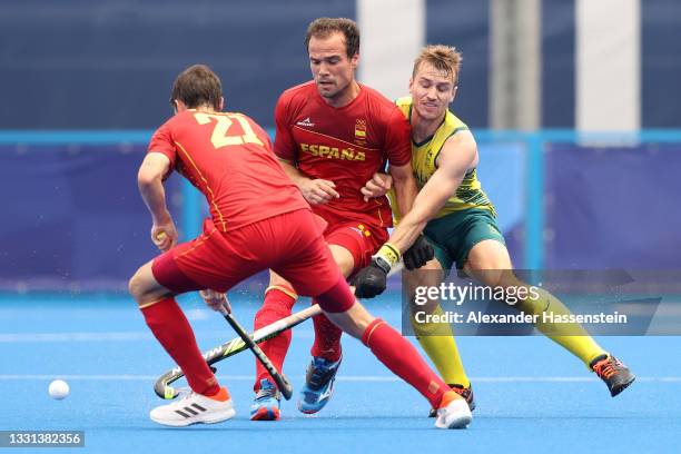 Vicenc Ruiz Torruella and Alvaro Iglesias Marcos of Team Spain battle for a loose ball against Joshua Simmonds of Team Australia during the Men's...