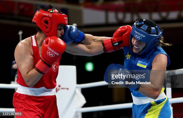 Busenaz Surmeneli of Team Turkey exchanges punches with Anna Lysenko of Team Ukraine during the Women's Welter quarter final on day seven of the...