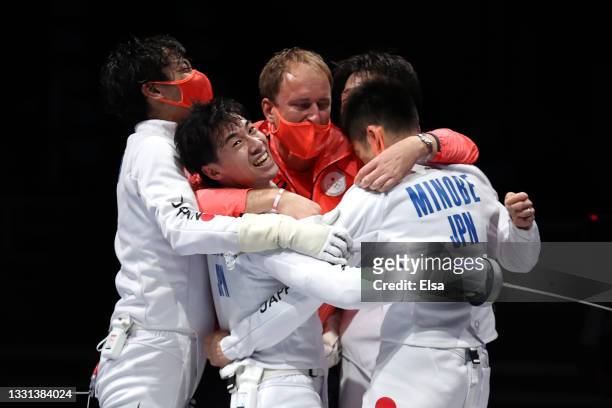 Team Japan celebrates after defeating Team Switzerland in Men's Épée Team Quarterfinal on day seven of the Tokyo 2020 Olympic Games at Makuhari Messe...