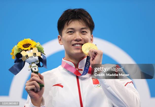 Gold medalist Shun Wang of Team China reacts on the podium during the medal ceremony for the Men's 200m Individual Medley Final on day seven of the...
