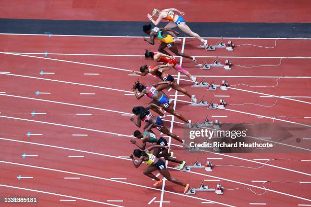 Athletes compete during round one of the Women's 100m heats on day seven of the Tokyo 2020 Olympic Games at Olympic Stadium on July 30, 2021 in...