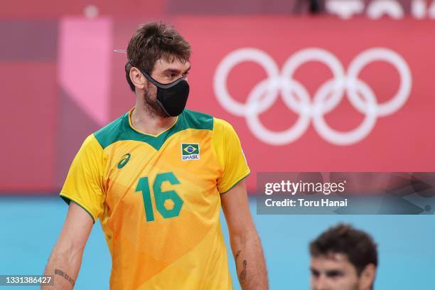 Lucas Saatkamp of Team Brazil reacts while wearing a face mask against Team United States during the Men's Preliminary Round - Pool B volleyball on...