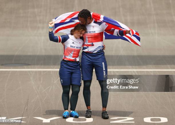 Gold medalist Bethany Shriever of Team Great Britain and silver medalist Kye Whyte of Team Great Britain celebrate while holding the flag of they...