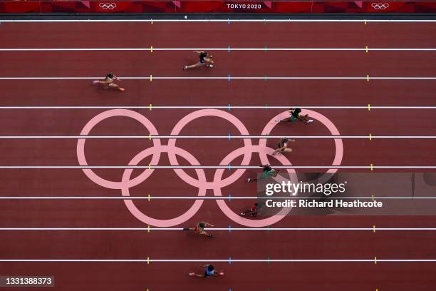 Shelly-Ann Fraser-Pryce of Team Jamaica competes during round one of the Women's 100m heats on day seven of the Tokyo 2020 Olympic Games at Olympic...