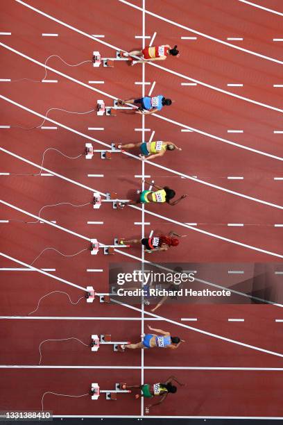 Athletes compete during round one of the Women's 100m heats on day seven of the Tokyo 2020 Olympic Games at Olympic Stadium on July 30, 2021 in...