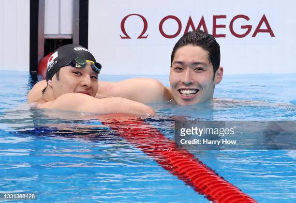 Daiya Seto of Team Japan and Kosuke Hagino of Team Japan reacts after the Men's 200m Individual Medley Final on day seven of the Tokyo 2020 Olympic...