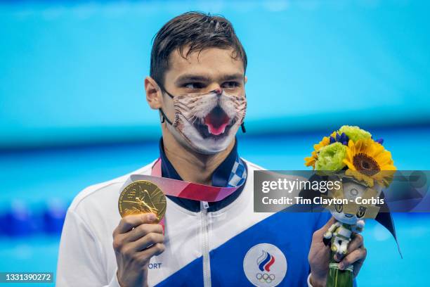 Evgeny Rylov of Russia with his gold medal while wearing a humorous mask after winning the 200m backstroke for men final during the Swimming Finals...