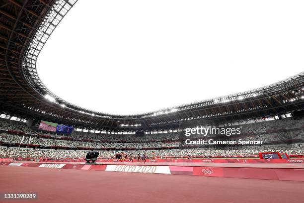 General view as athletes compete during round one of the Women's 100m heats on day seven of the Tokyo 2020 Olympic Games at Olympic Stadium on July...