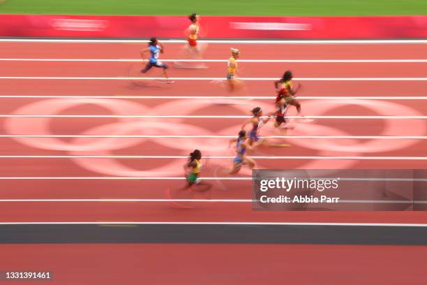 Shericka Jackson of Team Jamaica leads during round one of the Women's 100 meters on day seven of the Tokyo 2020 Olympic Games at Olympic Stadium on...