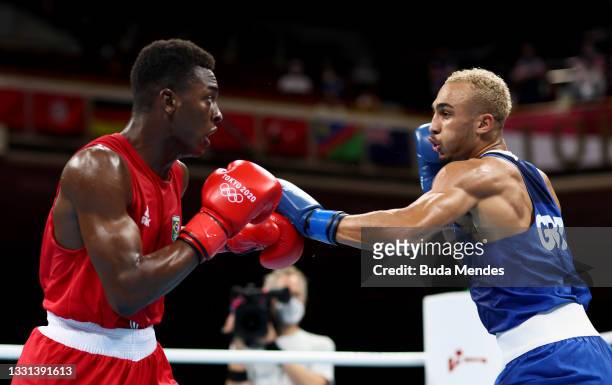 Keno Machado of Team Brazil exchanges punches with Bejamin Whittakker of Team Great Britain during the Men's Light Heavy quarter final on day seven...