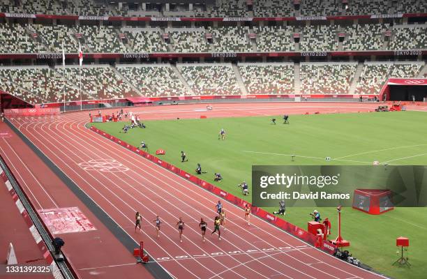 General view as Athletes compete during round one of the Women's 100m heats on day seven of the Tokyo 2020 Olympic Games at Olympic Stadium on July...