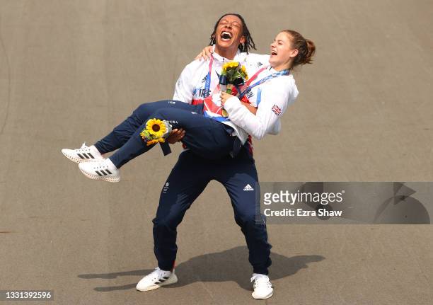 Silver medalist Kye Whyte and gold medalist Bethany Shriever of Team Great Britain pose for a photograph while celebrate at the medal ceremony after...
