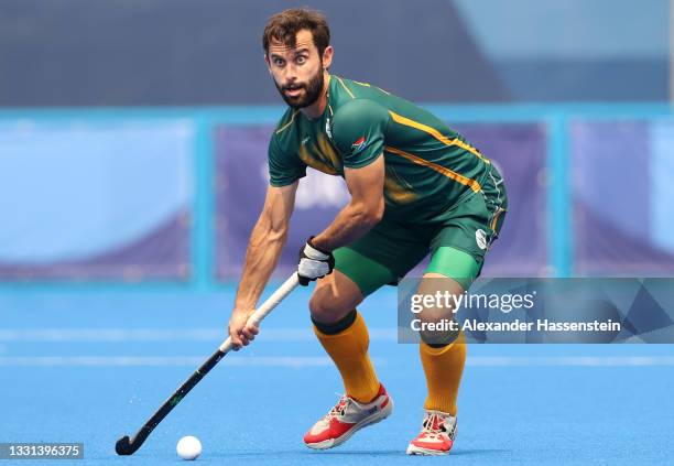 Jethro Ray Eustice of Team South Africa controls the ball during the Men's Preliminary Pool A match between Canada and South Africa on day seven of...