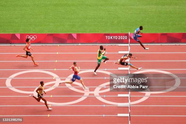 Kyron McMaster of Team British Virgin Islands leads during round one of the Men's 400 meter hurdles on day seven of the Tokyo 2020 Olympic Games at...