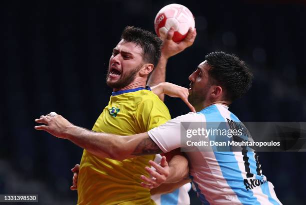 Haniel Langaro of Team Brazil attempts to shoot at goal whilst being challenged by Nicolas Bonanno of Team Argentina during the Men's Preliminary...