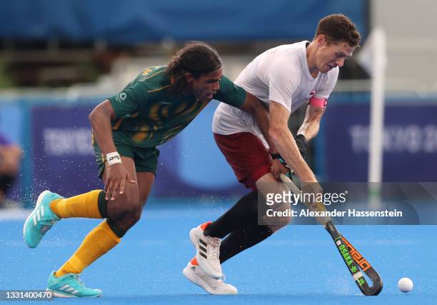 Scott William Martin Tupper of Team Canada competes for the ball against Mustaphaa Cassiem of Team South Africa during the Men's Preliminary Pool A...