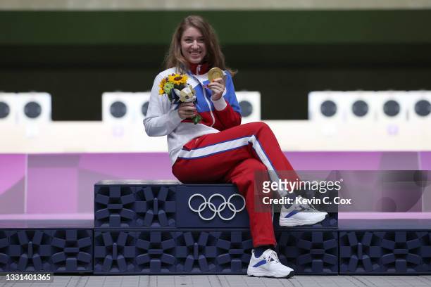 Gold Medalist Vitalina Batsarashkina of Team ROC poses on the podium following the 25m Pistol Women's Finals on day seven of the Tokyo 2020 Olympic...