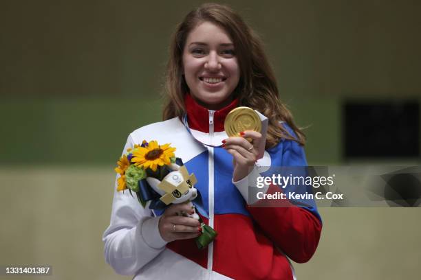 Gold Medalist Vitalina Batsarashkina of Team ROC poses on the podium following the 25m Pistol Women's Finals on day seven of the Tokyo 2020 Olympic...