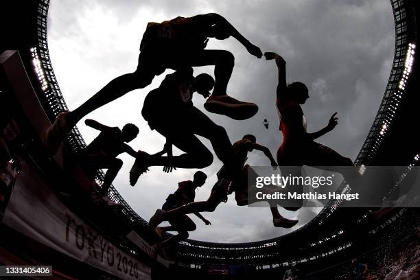 Athletes compete during round one of the Men's 3000m Steeplechase heats on day seven of the Tokyo 2020 Olympic Games at Olympic Stadium on July 30,...