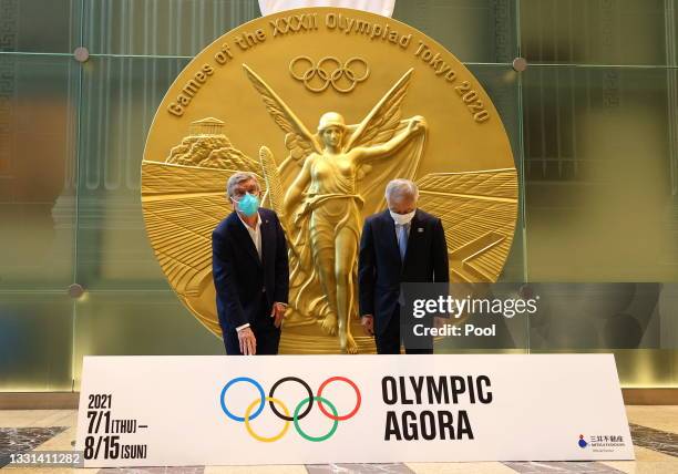 International Olympic Committee President Thomas Bach is escorted by Mitsui Fudosan Group President and CEO Masanobu Komoda in front of a large-scale...