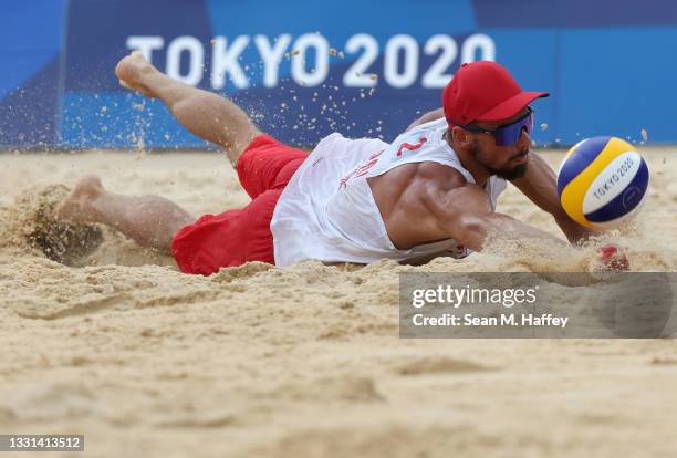 Bartosz Losiak of Team Poland competes against Team Italy during the Men's Preliminary - Pool F beach volleyball on day seven of the Tokyo 2020...