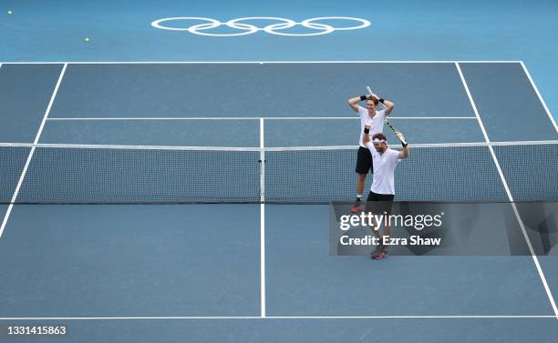 Marcus Daniell of Team New Zealand and Michael Venus of Team New Zealand celebrate victory against Tennys Sandgren of Team USA and Austin Krajicek of...