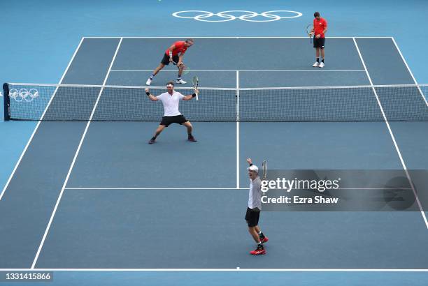 Marcus Daniell of Team New Zealand and Michael Venus of Team New Zealand celebrate victory against Tennys Sandgren of Team USA and Austin Krajicek of...