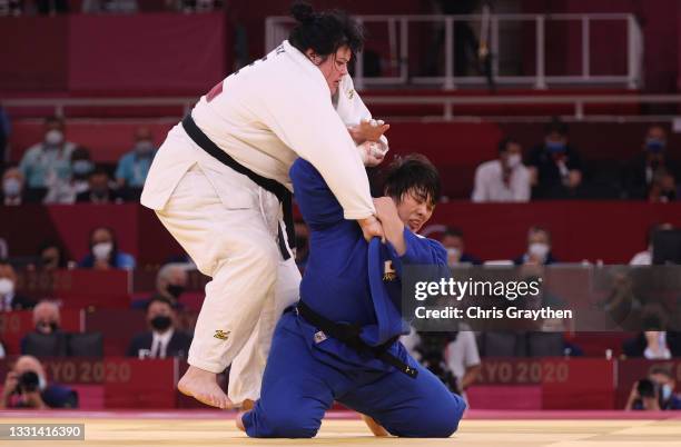 Akira Sone of Team Japan and Iryna Kindzerska of Team Azerbaijan compete during the Women’s Judo +78kg Semifinal of Table B on day seven of the Tokyo...