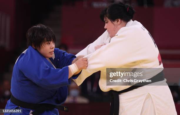 Akira Sone of Team Japan and Iryna Kindzerska of Team Azerbaijan compete during the Women’s Judo +78kg Semifinal of Table B on day seven of the Tokyo...