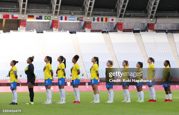 Players of Team Brazil stand for the national anthem prior to the Women's Quarter Final match between Canada and Brazil on day seven of the Tokyo...