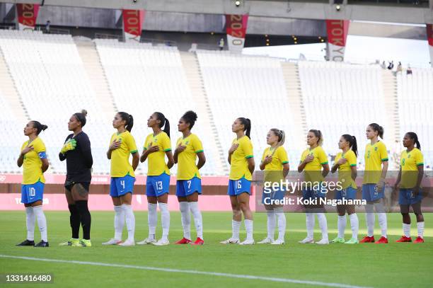 Players of Team Brazil stand for the national anthem prior to the Women's Quarter Final match between Canada and Brazil on day seven of the Tokyo...