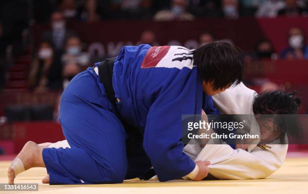 Akira Sone of Team Japan and Iryna Kindzerska of Team Azerbaijan compete during the Women’s Judo +78kg Semifinal of Table B on day seven of the Tokyo...