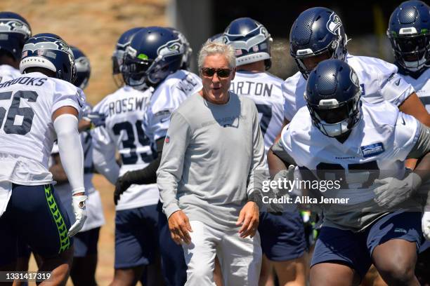Head coach Pete Carroll # of the Seattle Seahawks watches his players warm up at Training Camp on July 29, 2021 in Renton, Washington.