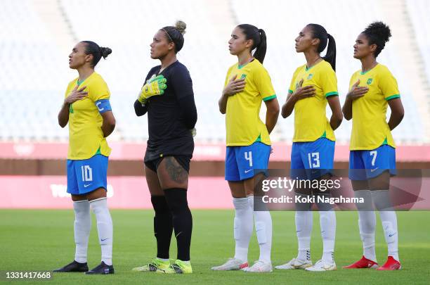 Marta, Barbara, Rafaelle, Bruna Benites and Duda of Team Brazil stand for the national anthem prior to the Women's Quarter Final match between Canada...