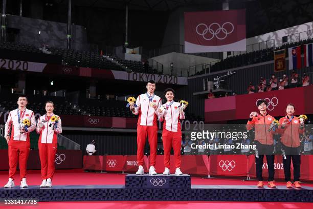 Silver medalists Zheng Si Wei and Huang Ya Qiong of Team China, gold medalists Wang Yi Lyu and Huang Dong Ping of Team China and bronze medalists...