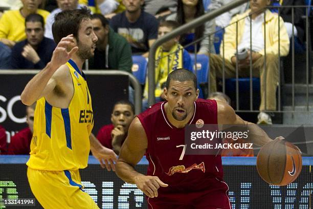Belgacom Spirou's player guard Justin Hamilton vies with Maccabi's guard Yogev Ohayon during the Euroleague basketball group playoffs group C on...