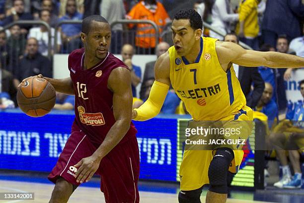 Belgacom Spirou's player guard Demon Mallet vies with Maccabi's forward David Blu during the Euroleague basketball group playoffs group C on November...